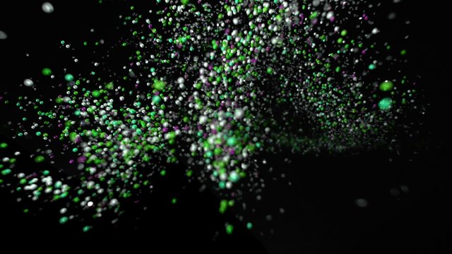 Camera follows colorful particles flying after being exploded against white background. Shot with high speed camera, phantom flex 4K.  Slow Motion. Unedited version is included at the end of clip.