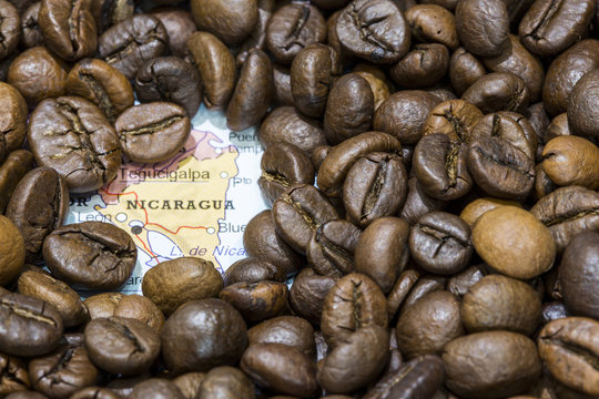 Map of Nicaragua under a background of coffee beans