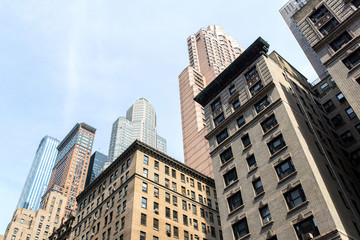 view from bottom of some buildings in the midtown of manhattan in new-york city