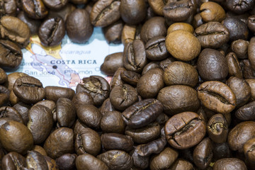 Map of Costa Rica under a background of coffee beans