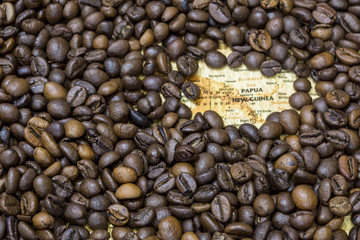 Map of Papua New Guinea under a background of coffee beans