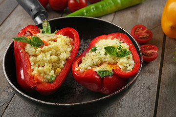 Stuffed peppers with vegetables on table close up