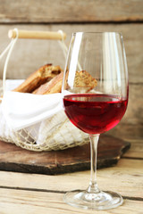 Still life of wine and bread on light background