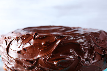 tasty chocolate cake on unfocused background