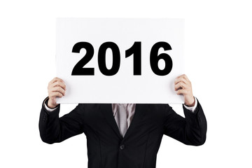 Entrepreneur covering his face with number 2016