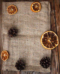 Background for a card, cloth, oranges and Christmas.