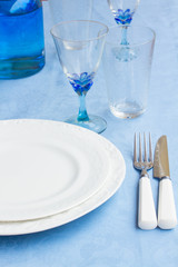 Tableware on blue cloth