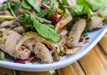 Sweet pork liver spicy salad  with onions on a plate, Thailand Food