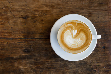 Close up blue cup of Coffee, latte on the wooden table