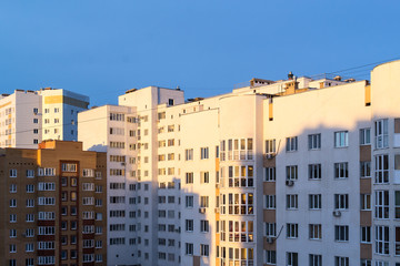 Fototapeta na wymiar Modern Apartment Building in Morning Sunlight