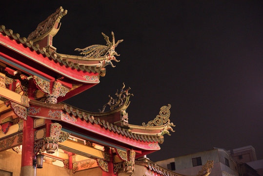 Decorated roof of Xingtian Temple at night in Taipei, Taiwan