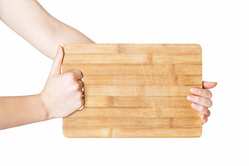 hands holding chopping board