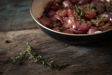 zwiebelkuchen of small red onions and thyme