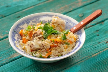 Roasted rice with meat, pumpking and fresh greens