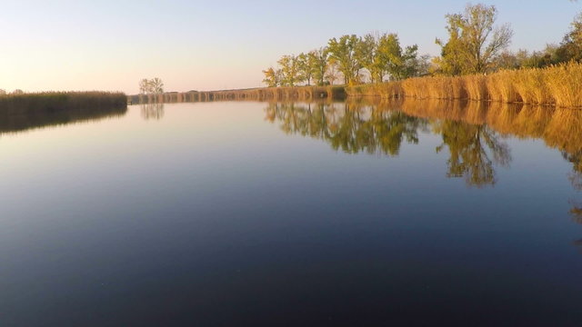 Aerial view of a lowland river. Sunny fall day.