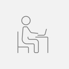 Businessman working at his laptop line icon.