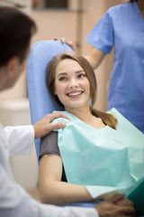 Dentist comforting patient