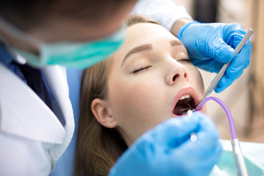 Dentist work with dental mirror and instrument
