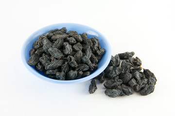 Dried grapes on white background