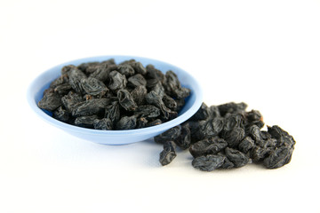 Dried grapes on white background