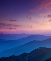 Hills lines in mountain valley during sunset. Natural summer mountain landscape