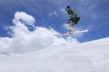Naklejka na ściany i meble Flying skier on mountains. Extreme sport