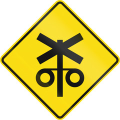 Obraz premium New Zealand road sign - Controlled railway crossing ahead with signals