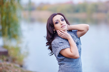 Naklejka premium beautiful woman on the background of the lake