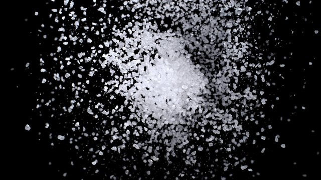 Sea salt exploding against black background. Shot with high speed camera, phantom flex 4K.  Slow Motion. 