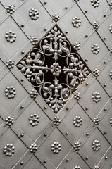 old iron door with with beautiful grille and decorative pattern