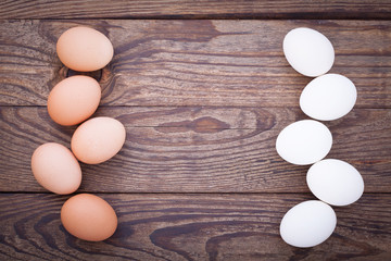 eggs on wooden background top view