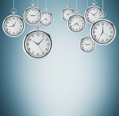Several models of pocket watches which are hovering in the air. A concept of a value of time in...