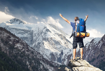 Obraz premium Tourist on mountain peak. Sport and active life concept.