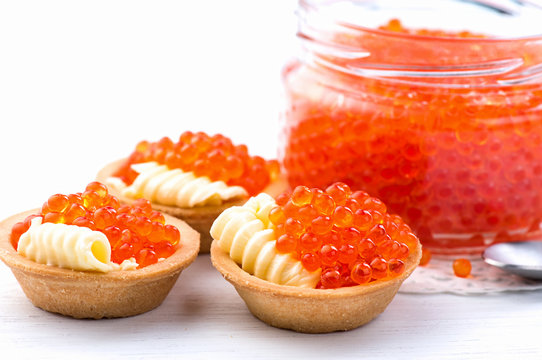 Tartlets with red caviar closeup. Gourmet food