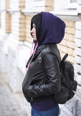 Outdoor fashion brunette stands 