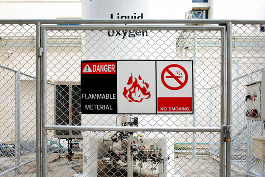Safety signs warning ( DANGER-FLAMMABLE MATERIAL,NO SMOKING ) in