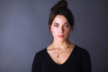 Portrait of an attractive fashionable young brunette woman