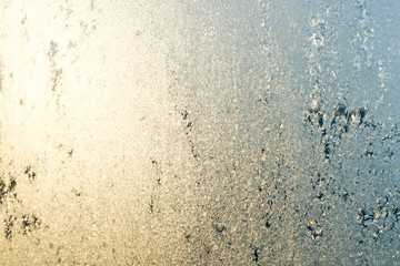 Frozen winter window in sunlight