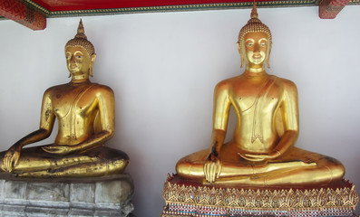 Golden Buddha Statues Inside The Temple of the Reclining Buddha in Bangkok Thailand
