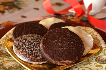 Detail of delicious Christmas cookies with cup of coffee on a table       