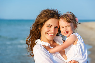 Mother and daughter on the beach