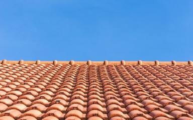 Red tiles roof and blue sky background
