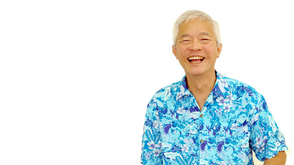 Asian senior guy on blue hawaii shirt laughing on white isolate