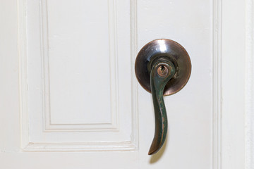 Modern style door handle on natural wooden white door