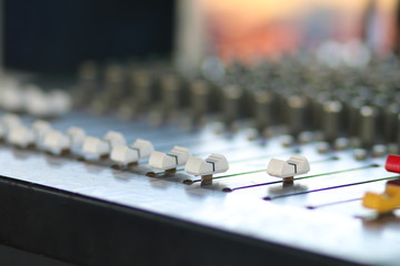 buttons equipment for sound mixer control, soft focus white botton