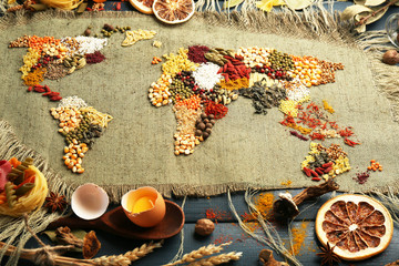 Spices on sackcloth on wooden background