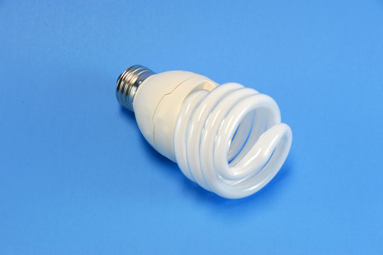 fluorescent light bulb on blue background