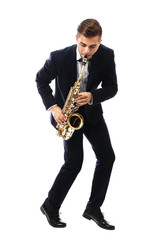Young man playing on saxophone isolated on white