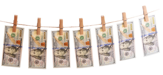 Fototapeta na wymiar Concept of money laundering - dollars are drying on cord isolated on white background