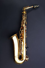 Beautiful golden saxophone on black background